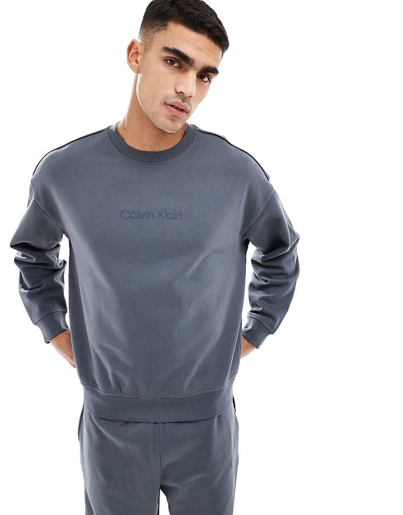 

Синяя толстовка с логотипом Calvin Klein Tonal Logo