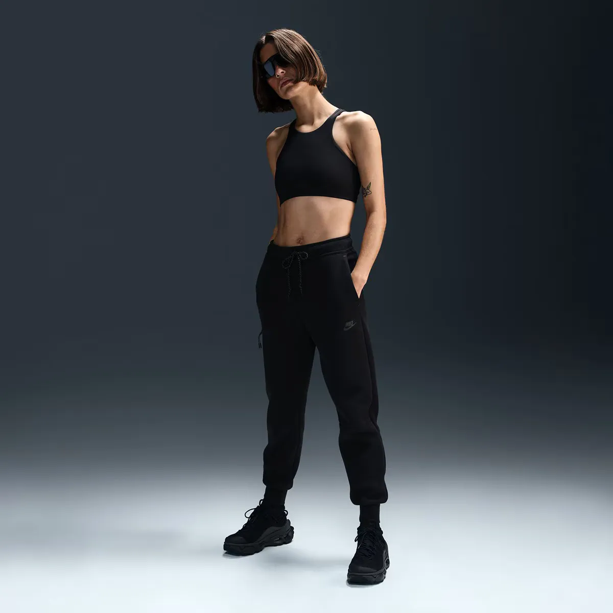 

Женские флисовые брюки Nike Tech, черный