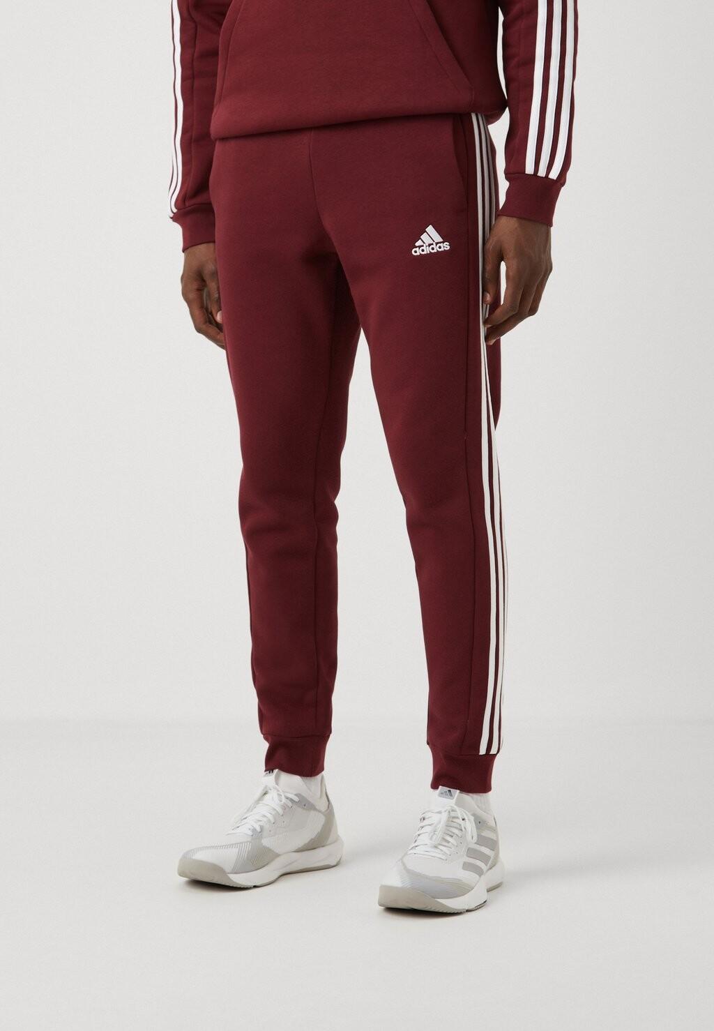 

Спортивные брюки ESSENTIALS TAPERED CUFF 3 STRIPES PANTS adidas Sportswear, красный