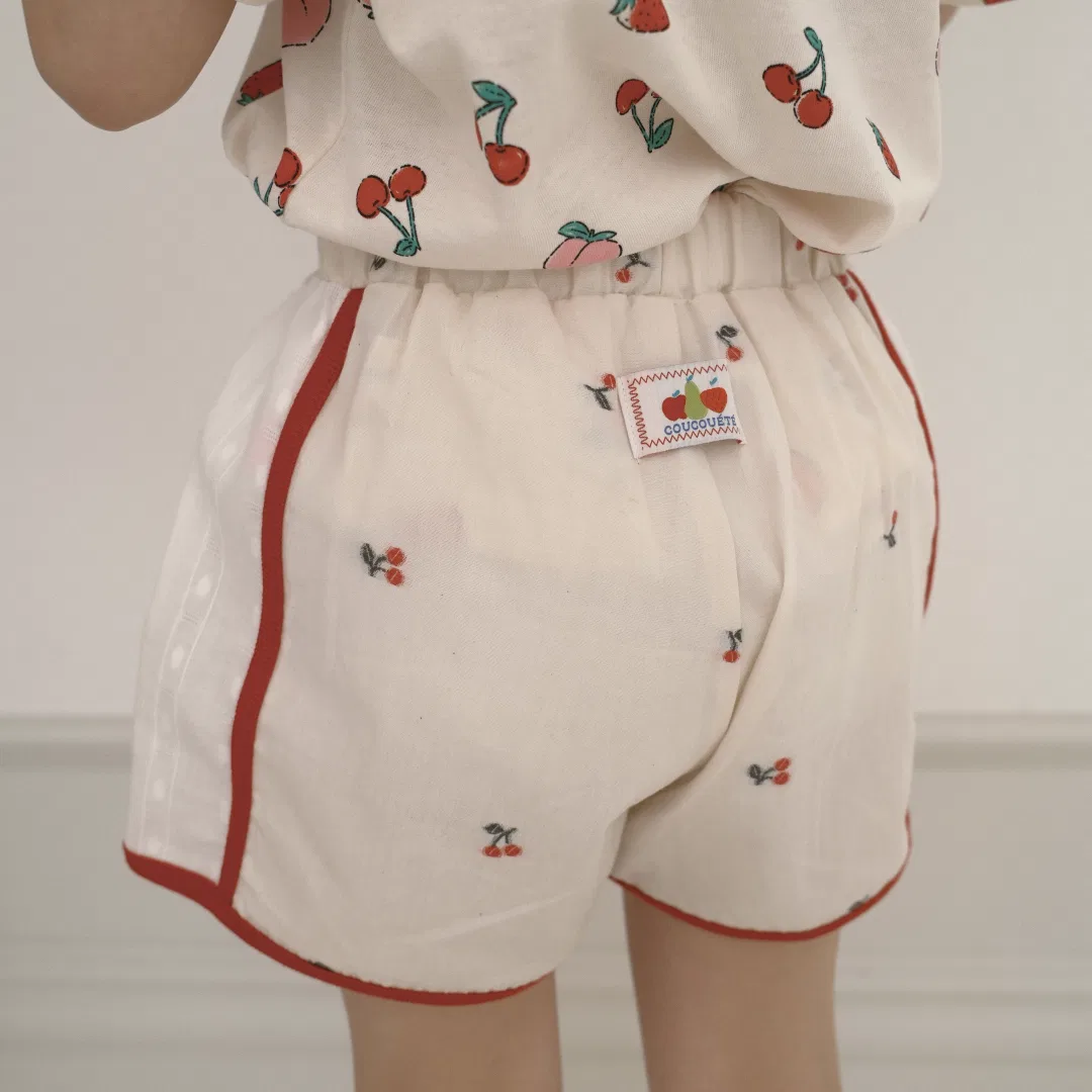 Детские спортивные брюки Cherry цвета айвори от Coucouété