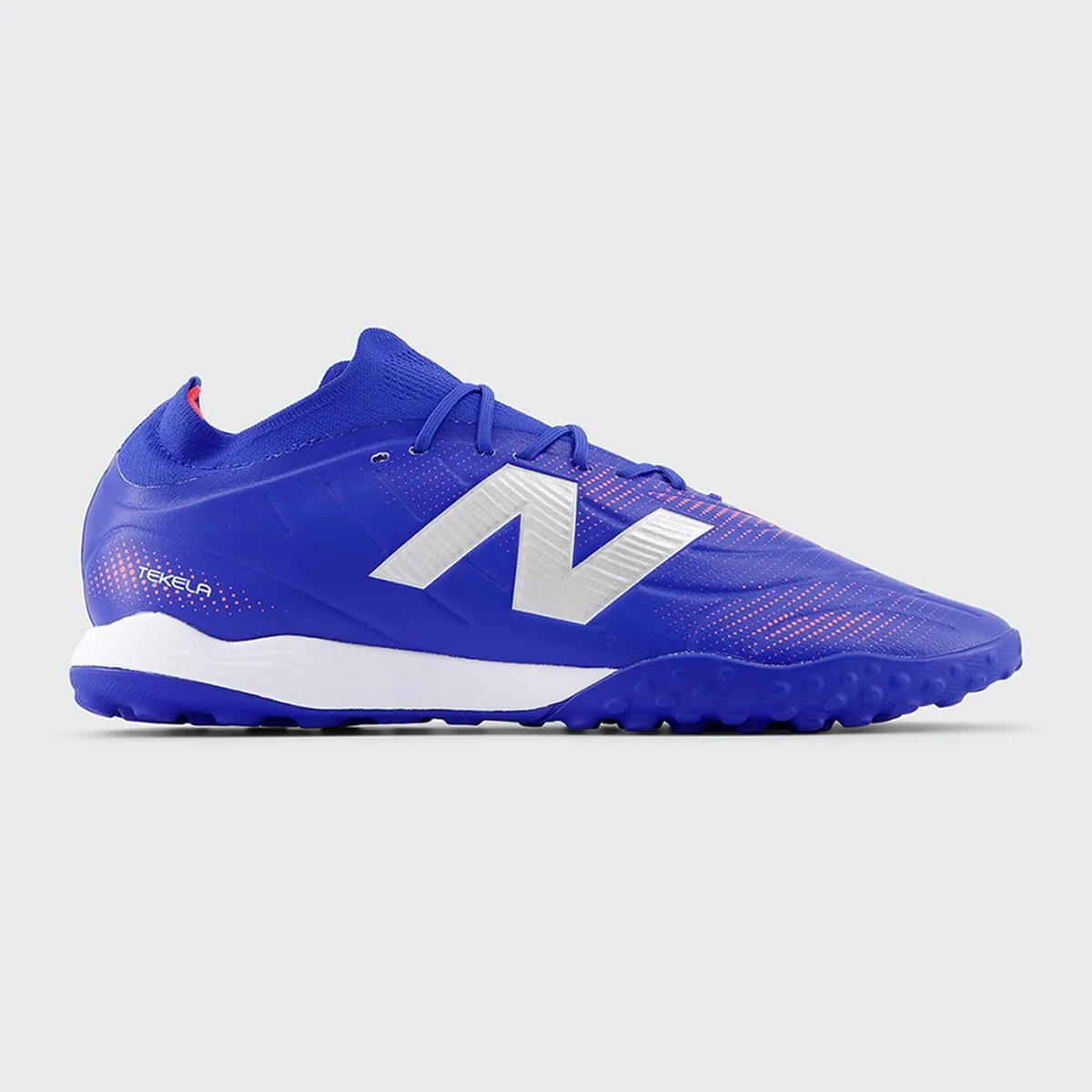 

Мужские футбольные бутсы TEKELA TEAM LOW LACED TF V5 New Balance, темно-синий/розовый