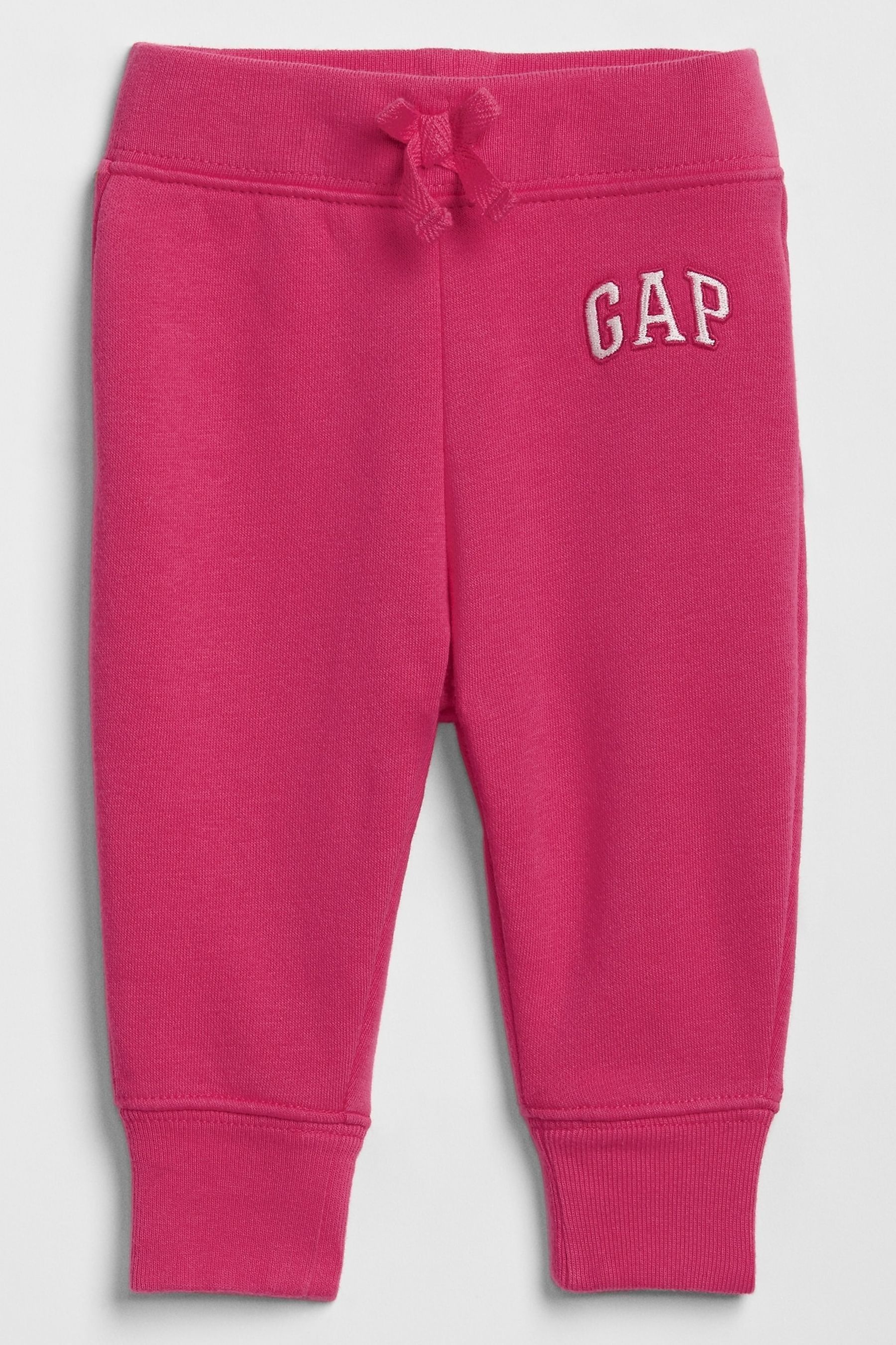 

Флисовые джоггеры с неоновым логотипом Gap, розовый