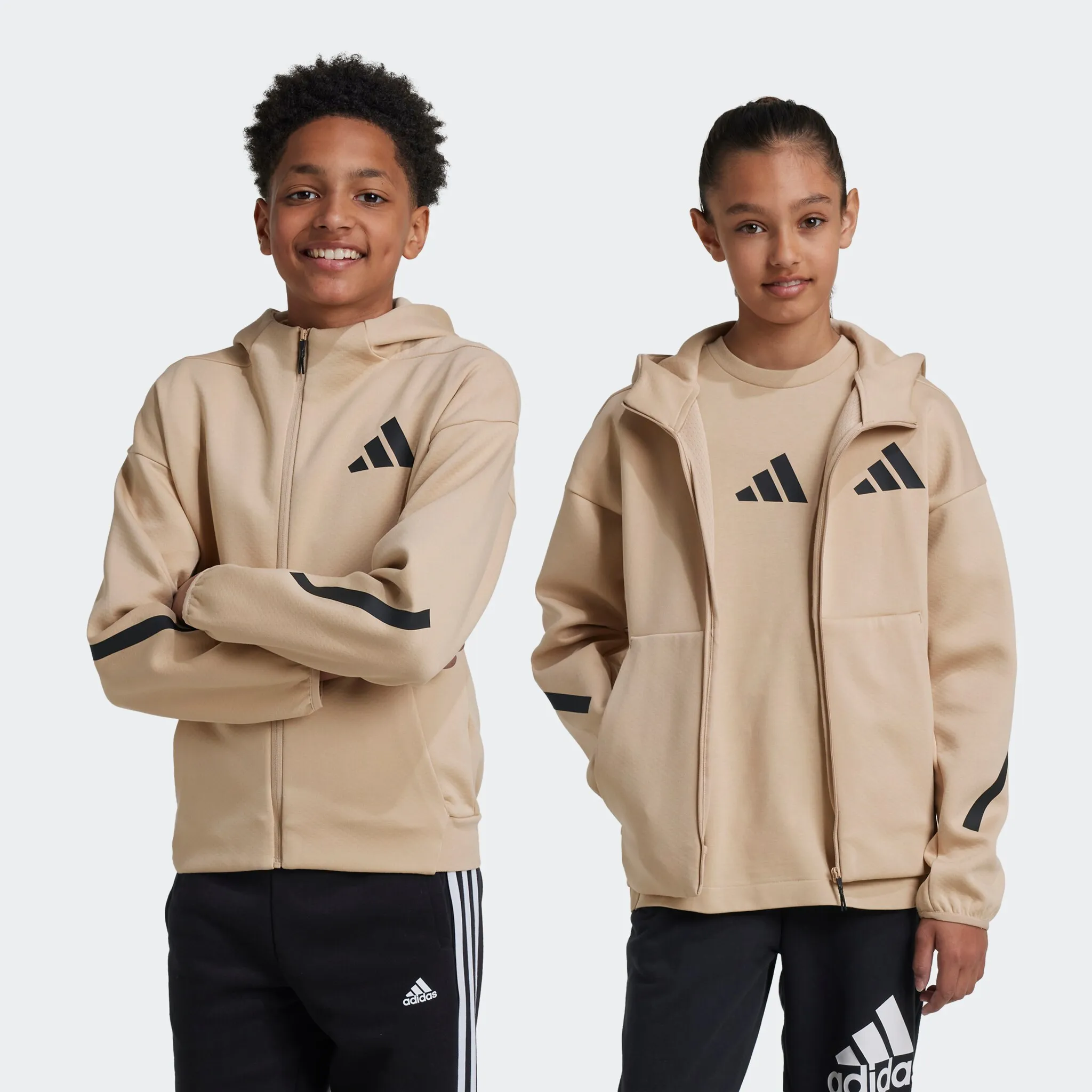 

Толстовка с капюшоном adidas Sportswear «J Z.N.E.FZ», цвет Magic Beige / Black