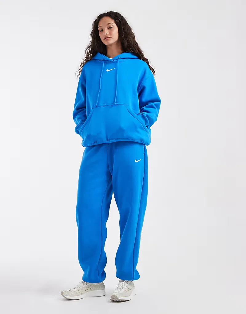 Спортивные брюки Nike Phoenix Fleece с высокой талией свободным кроем и манжетами, синий