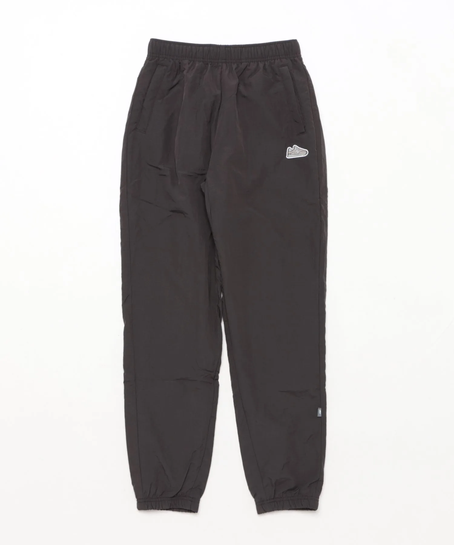 Детские ветрозащитные штаны из нейлона New Balance ABP55565 чёрные