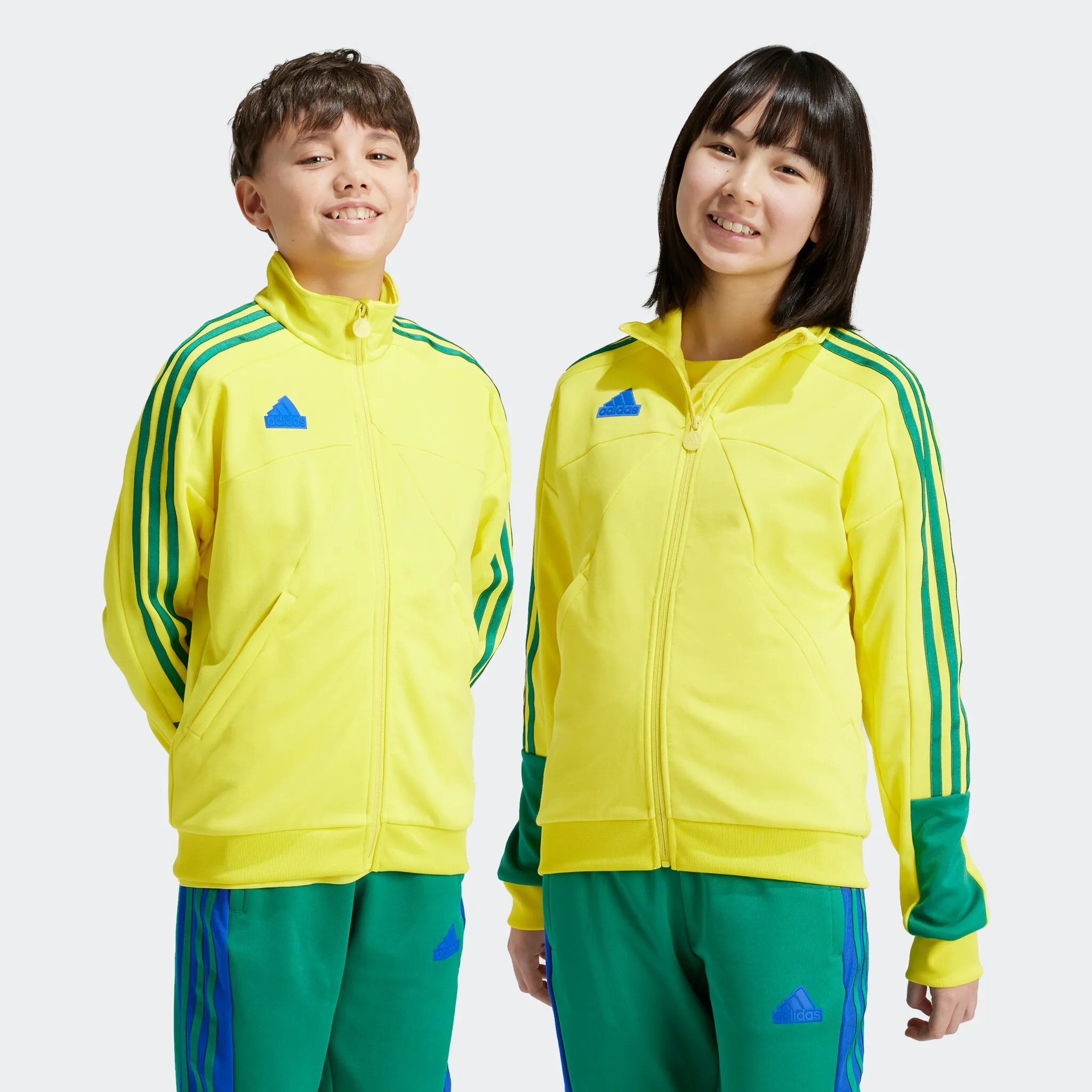 

Спортивная куртка Adidas Sportswear "J NP TTOP", цвет Bright Yellow / Bold Green / Bold Blue