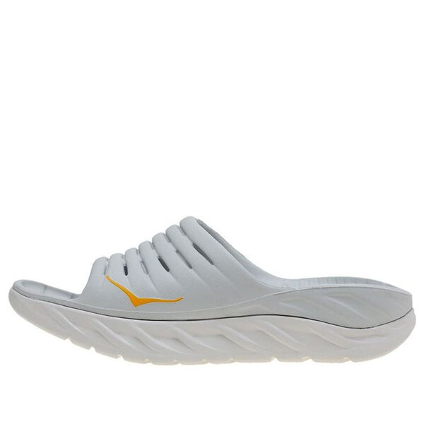 

Тапочки recovery slide2 'lunar rock radiant yellow' Hoka One One, серый