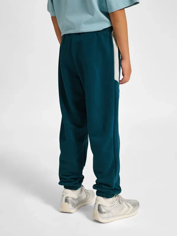 Спортивные штаны Hummel Hmljr loose blocked tracksuit bottoms, цвет отражающий пруд — фото 3