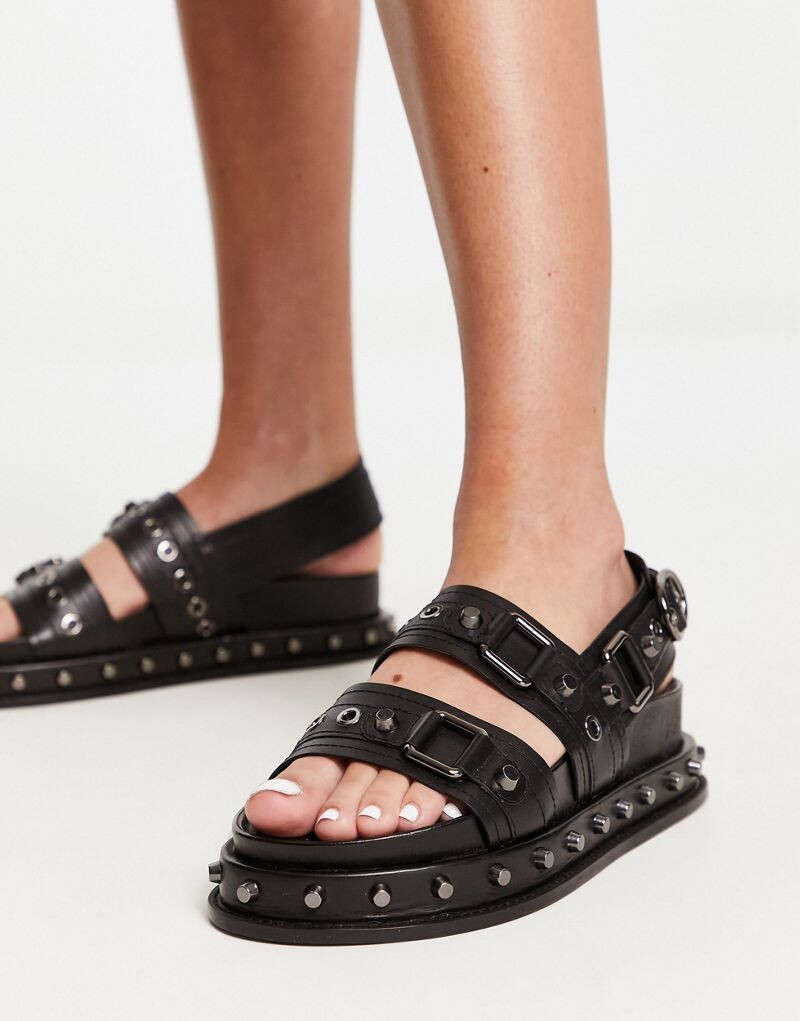 

Черные кожаные сандалии на плоской подошве с шипами ASOS DESIGN Focused