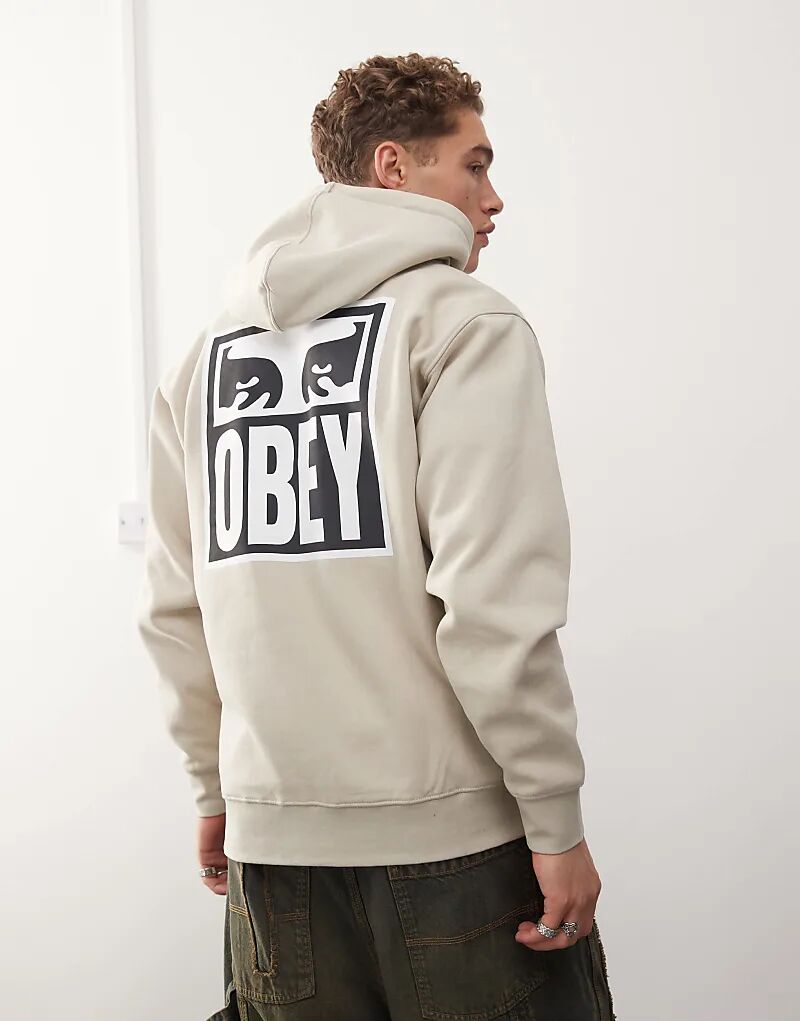 

Толстовка с капюшоном и графическим принтом icon eyes бежевого цвета Obey