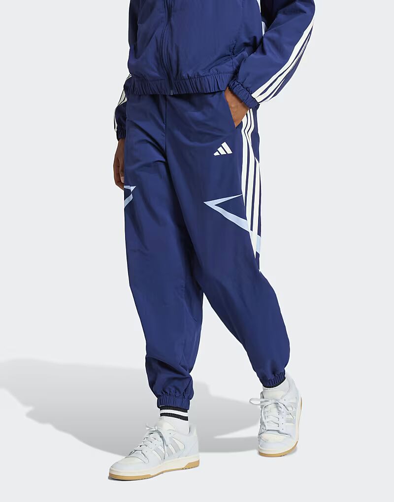 

Брюки Adidas performance Tiro cut с тремя полосками и манжетами в цвете «цветной блок» темно-синего/светящегося синего цвета