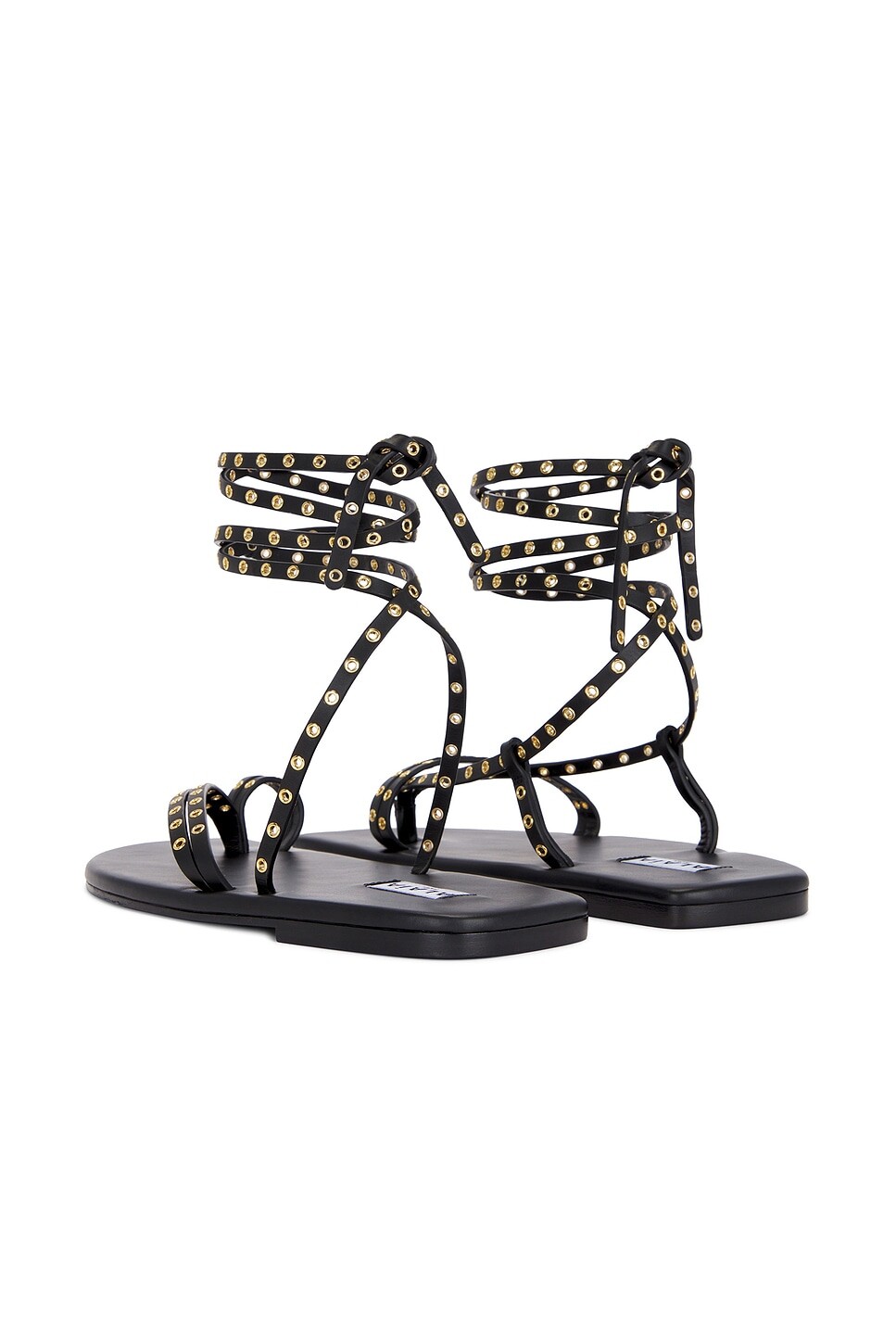 Сандалии на плоской подошве с ремешками Alaïa, цвет Noir — фото 4