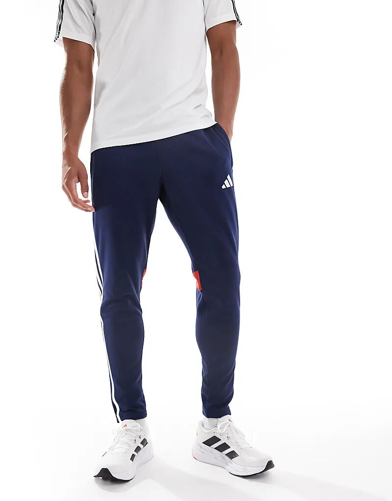 

Зимние тренировочные брюки adidas Football Tiro 25 Essentials в цвете Team Navy Blue 2 / Red / White Adidas Performance
