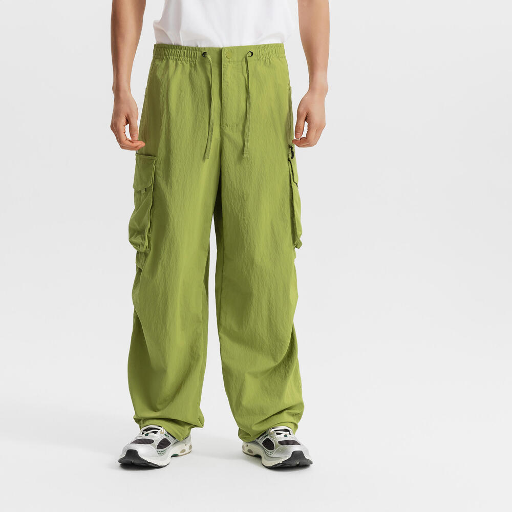 

Унисекс спортивные брюки Decathlon SPORTSWEAR городские функциональные с несколькими карманами в оливковом цвете