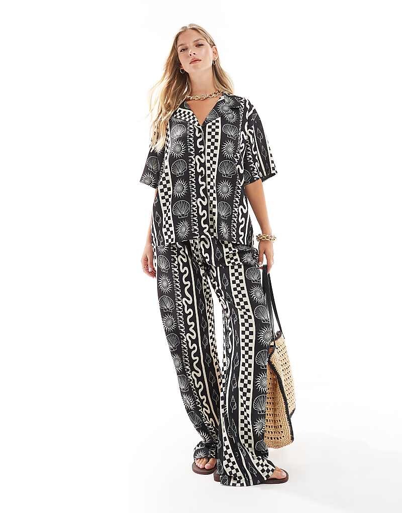 

ASOS DESIGN – Черно-белые широкие брюки с праздничным узором, часть комплекта