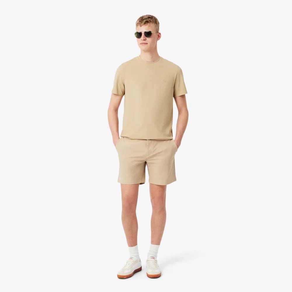 Мужские эластичные шорты-бермуды из полиэстера бежевые от Lacoste