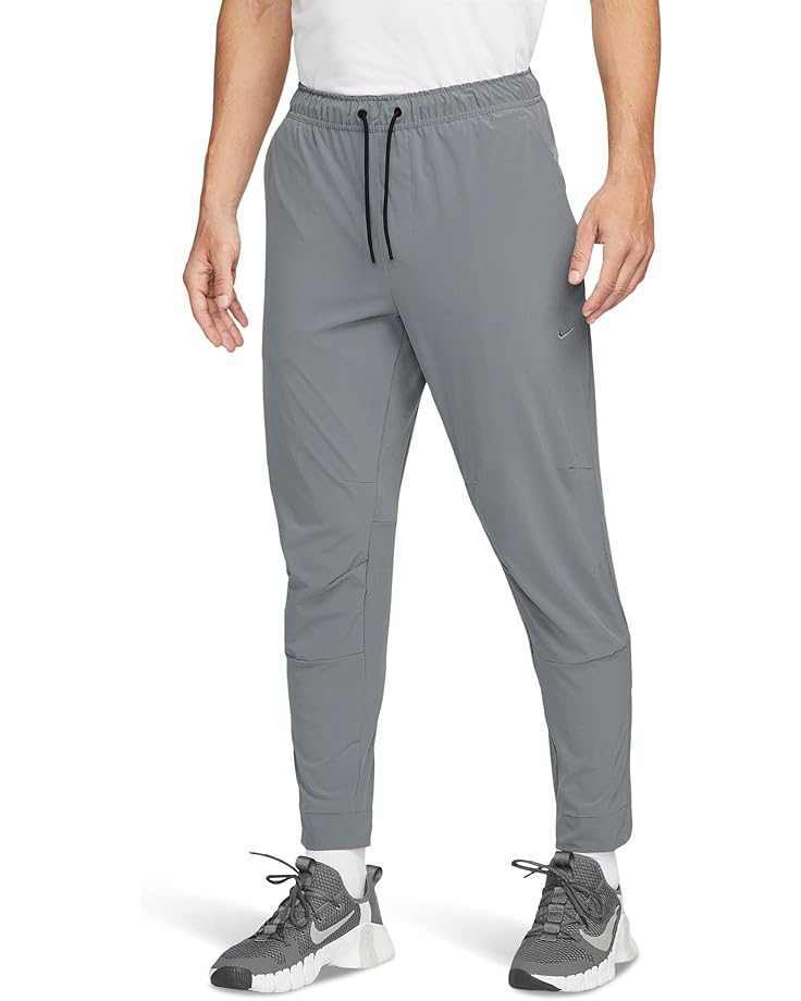 

Брюки Nike Dri-FIT Unlimited Tapered Pants, цвет Smoke Grey/Black/Smoke Grey
