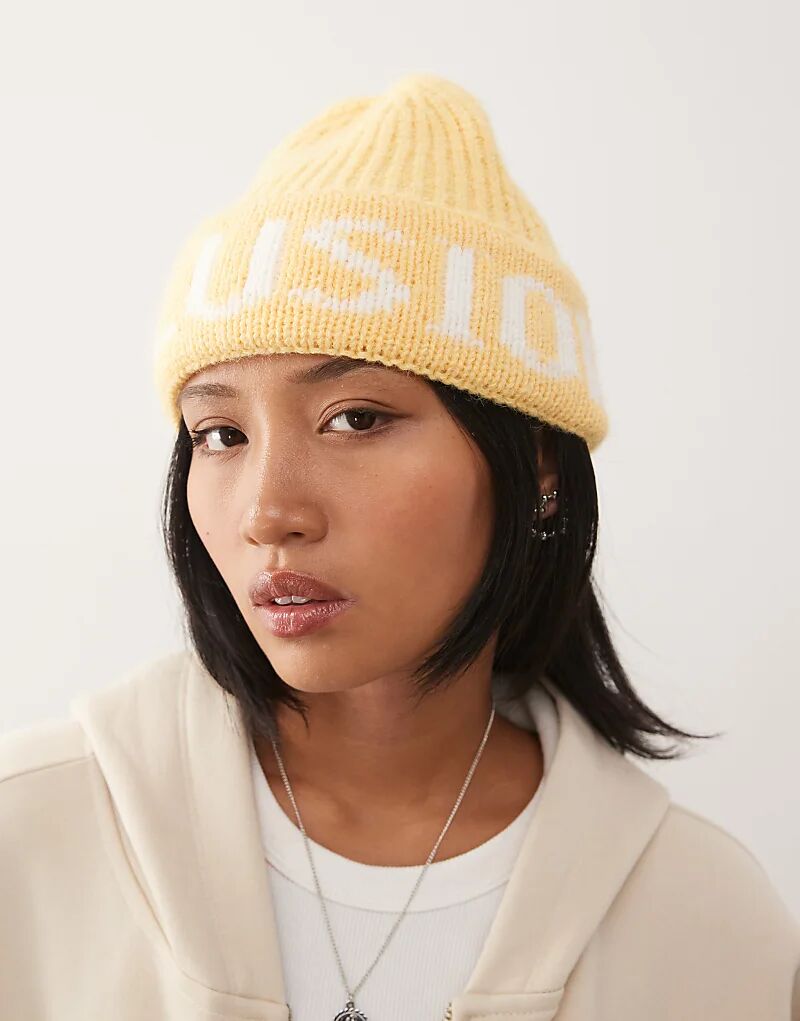 

Пушистая шапочка с логотипом COLLUSION цвета пахты и желтого цвета