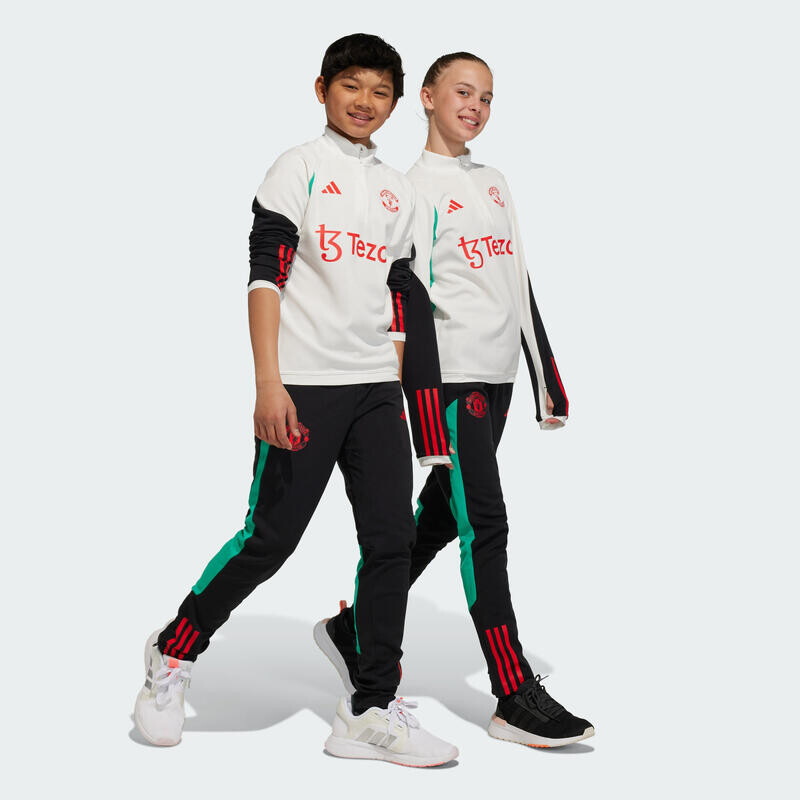 

Тренировочные брюки Manchester United Tiro 23 Juniors ADIDAS, цвет schwarz
