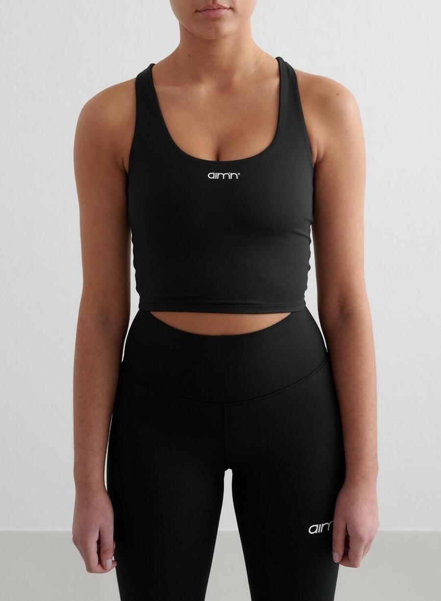 

AIM'N Женский спортивный бюстгальтер для йоги с влагоотводящим эффектом, с перекрещивающимися чашечками на спине, черный