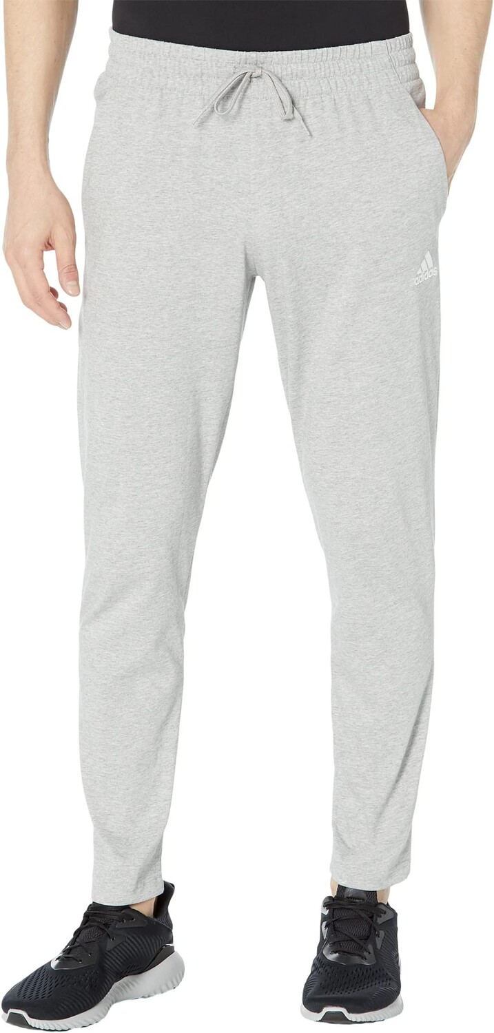 

Брюки зауженного кроя с открытым подолом из одинарного джерси Essentials adidas, цвет Medium Grey Heather