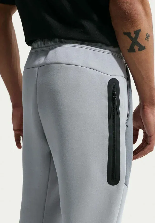 Спортивные штаны Nike Sportswear M nk tch flc jggr tracksuit bottoms, светло-серебристый черный — фото 3