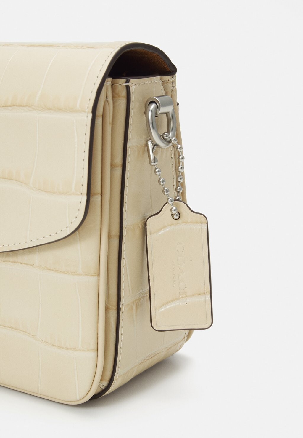 

Большая сумка EMBOSSED CASSIE CROSSBODY Coach, бежевый