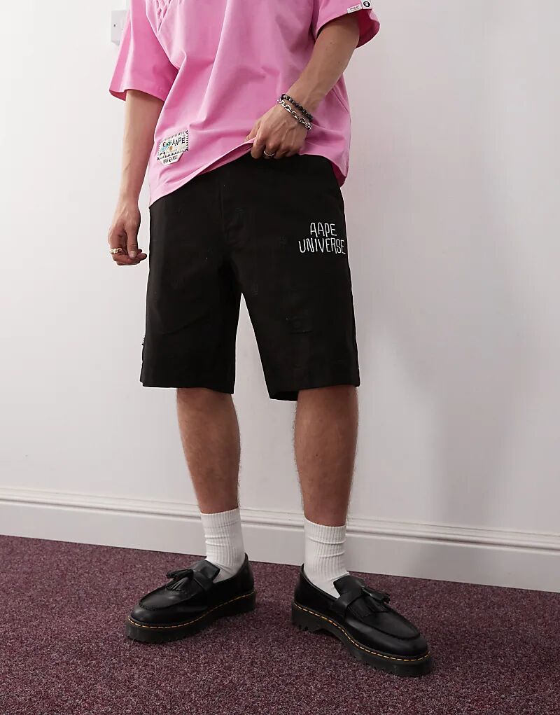 

Свободные шорты Aape By A Bathing Ape черного цвета с принтом логотипа по всей поверхности Aape By A Bathing Ape