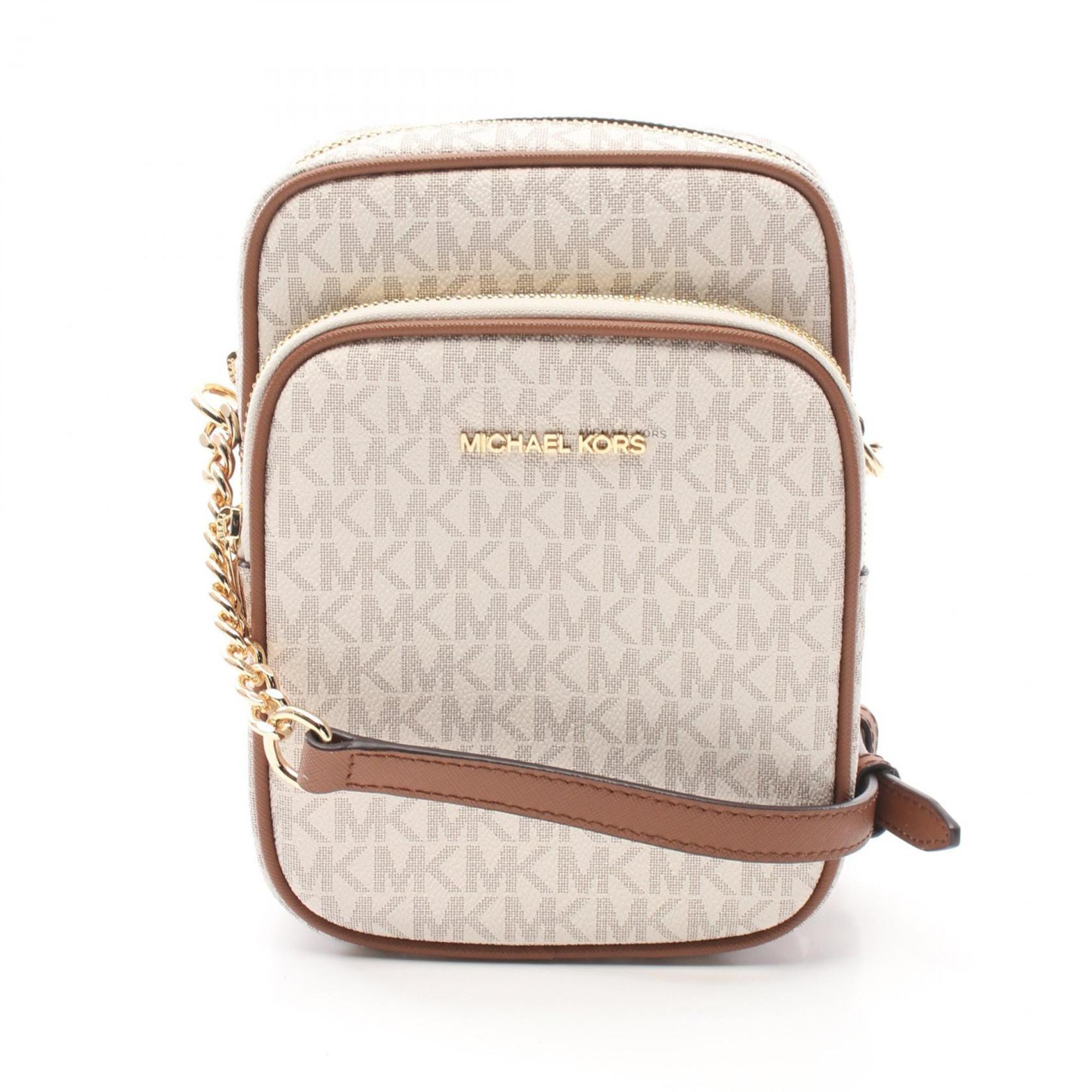 

Michael Kors Jet Set Дорожная сумка через плечо из кожи с покрытием Canvas Сумка на выходные, коричневый/белый