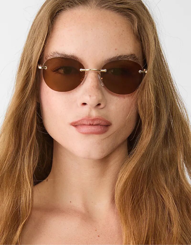 

Солнцезащитные очки Stradivarius овальной формы из металла коричневого цвета