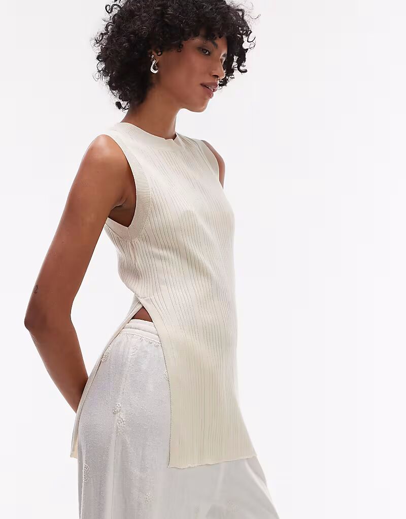 

Длинный трикотажный топ без рукавов с разрезами по бокам цвета кремовый Mango