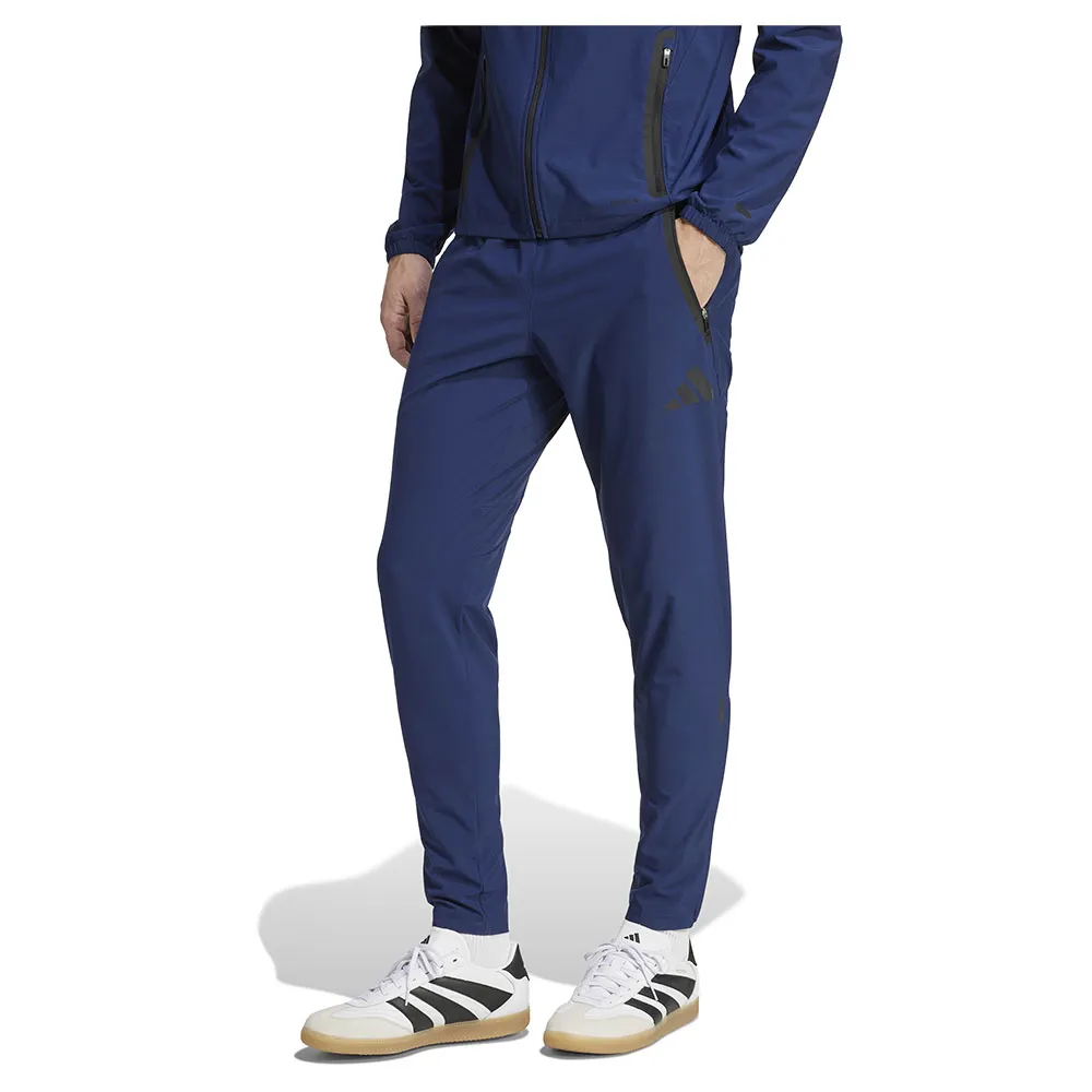 

Брюки adidas Manchester United Tiro 25 Competition Vis Tech travel tracksuit, синий
