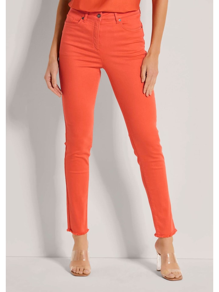 

MADELEINE Узкие джинсы средней посадки с бахромой цвета кроваво-оранжевого