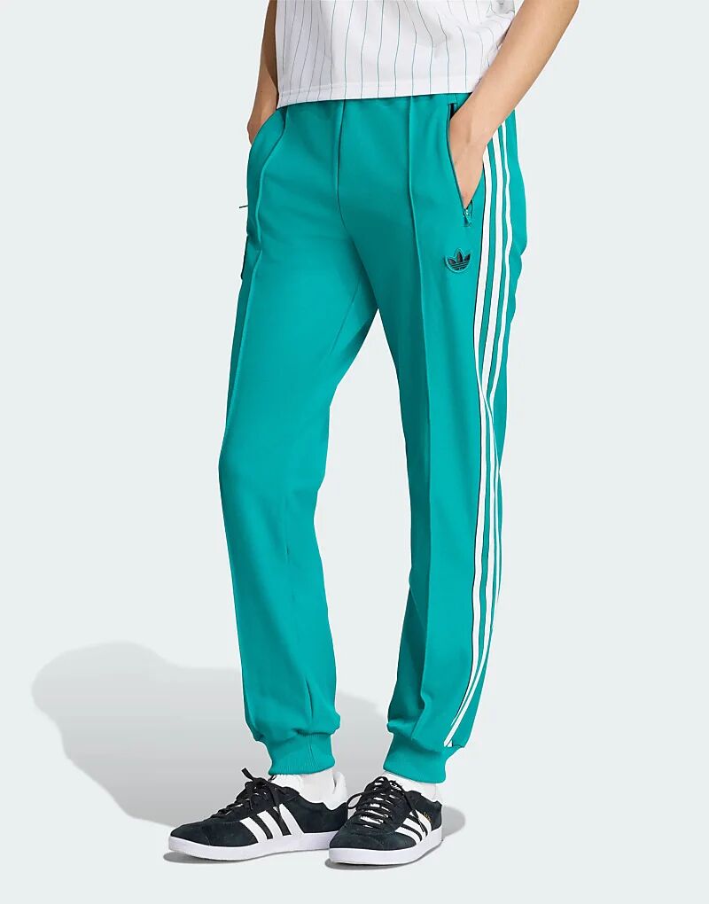 

Спортивные брюки Adidas Originals Liverpool FC Terrace Icons цвета морской волны