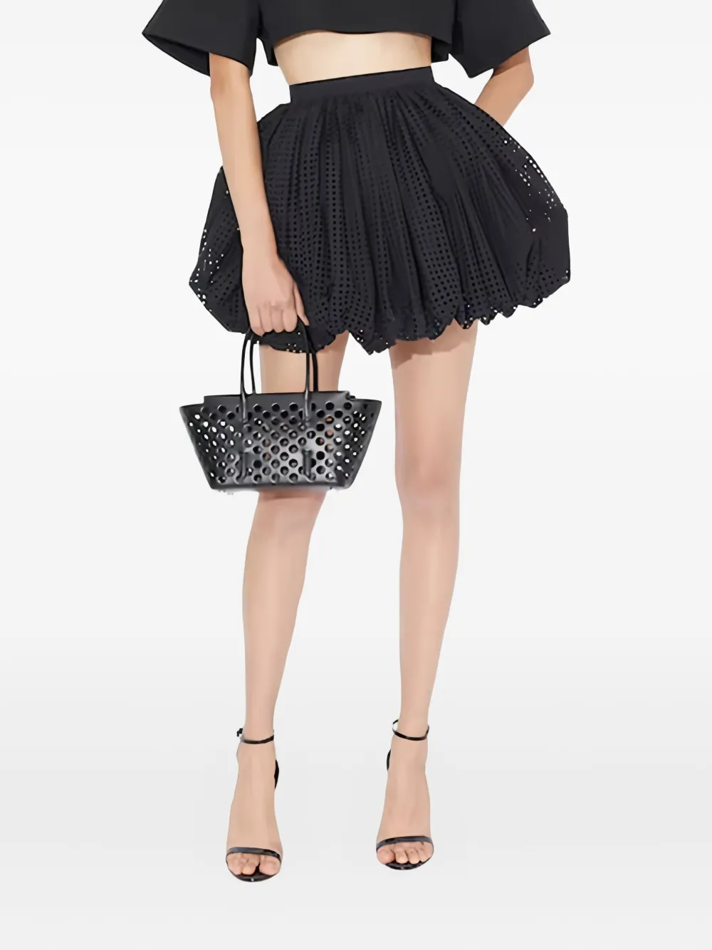 

Мини-юбка с вырезами Alaïa, черный