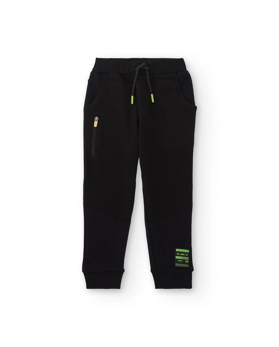 

Черные джоггеры для мальчика с зелеными деталями Tuc tuc