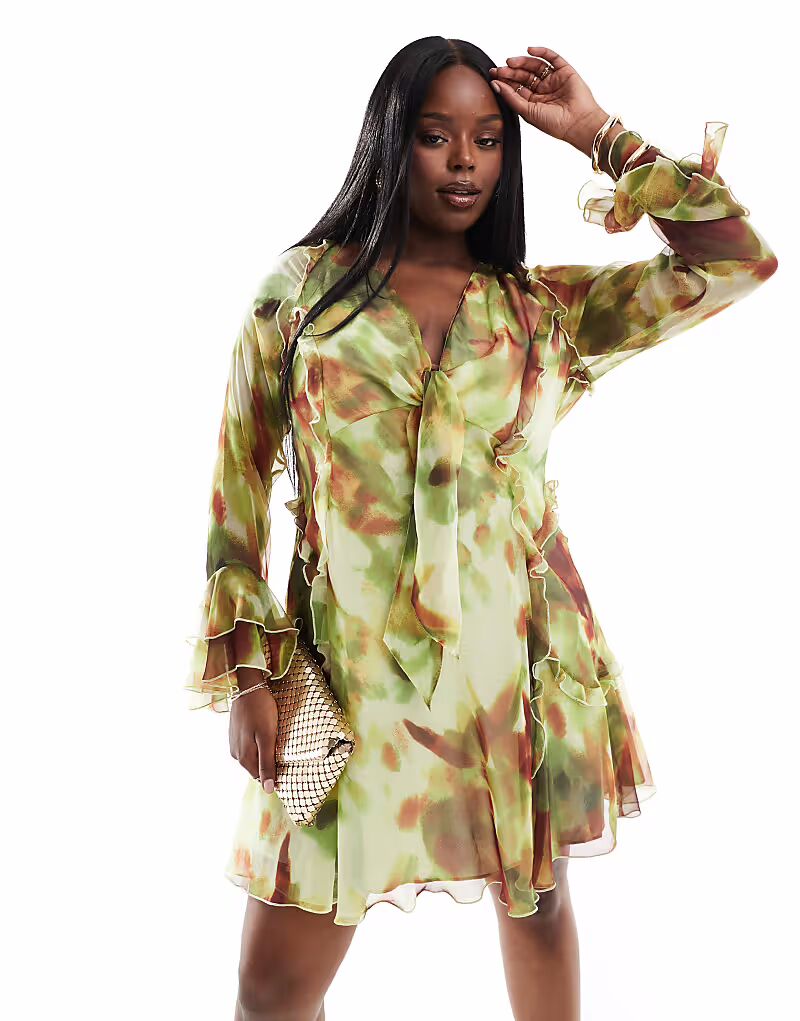 

Мини-платье ASOS DESIGN Curve с глубоким вырезом, оборками, завязками спереди, рукавами-оборками и зеленым абстрактным принтом ASOS Curve