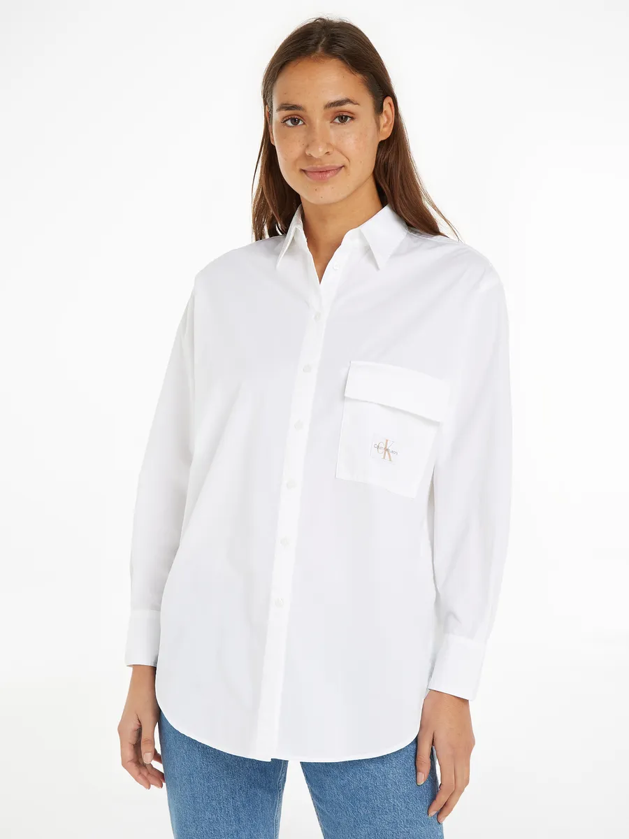 

Длинная блузка Calvin Klein Jeans "LONG COTTON UTILITY LS SHIRT" с нашивкой-логотипом, белый