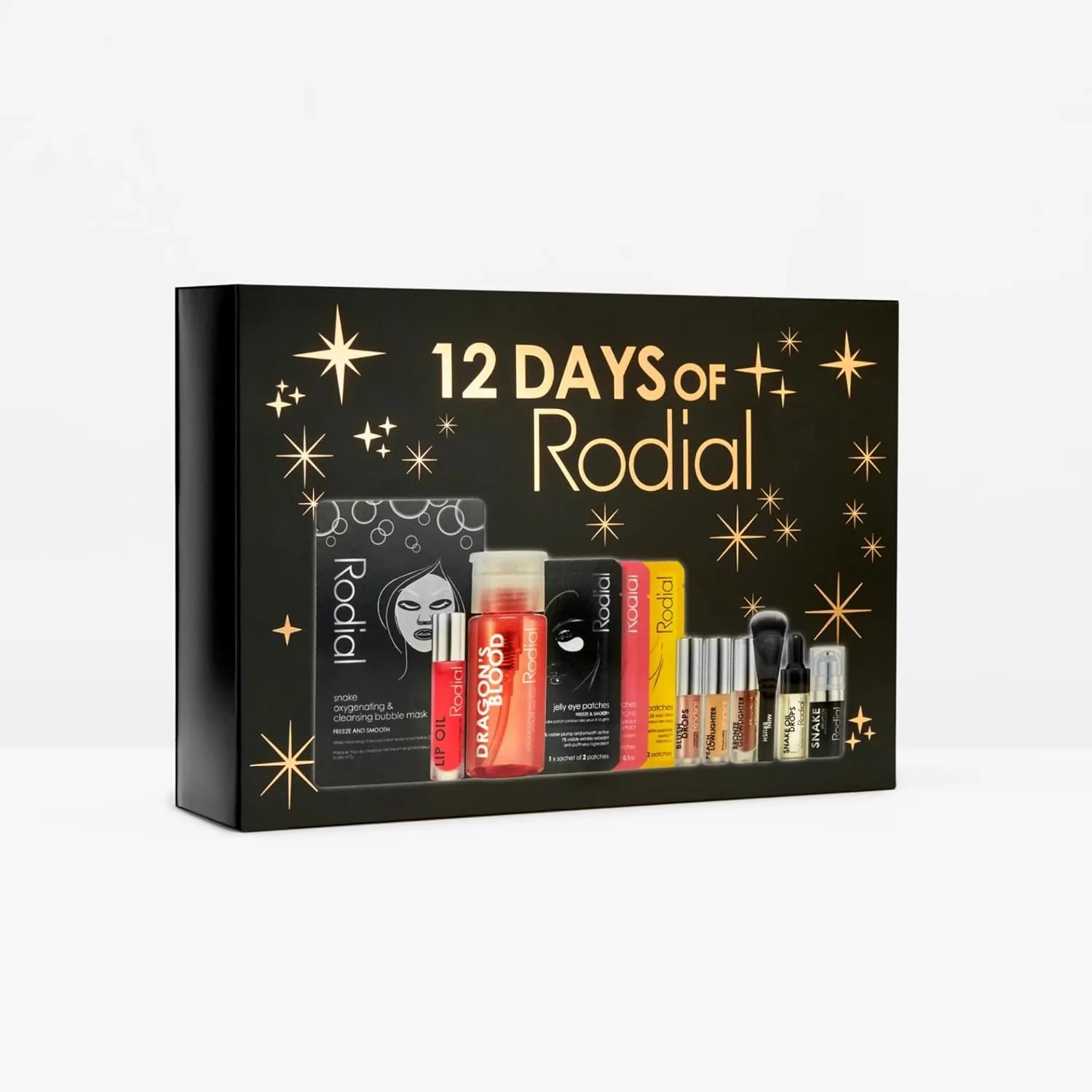 Календарь Advent от Rodial на 12 дней 2025 - подарочный набор люксовой косметики с масками, патчами для глаз, Glow Drops, очищающими средствами, Lip Oil и другими продуктами - лимитированная праздничная коллекция — фото 4