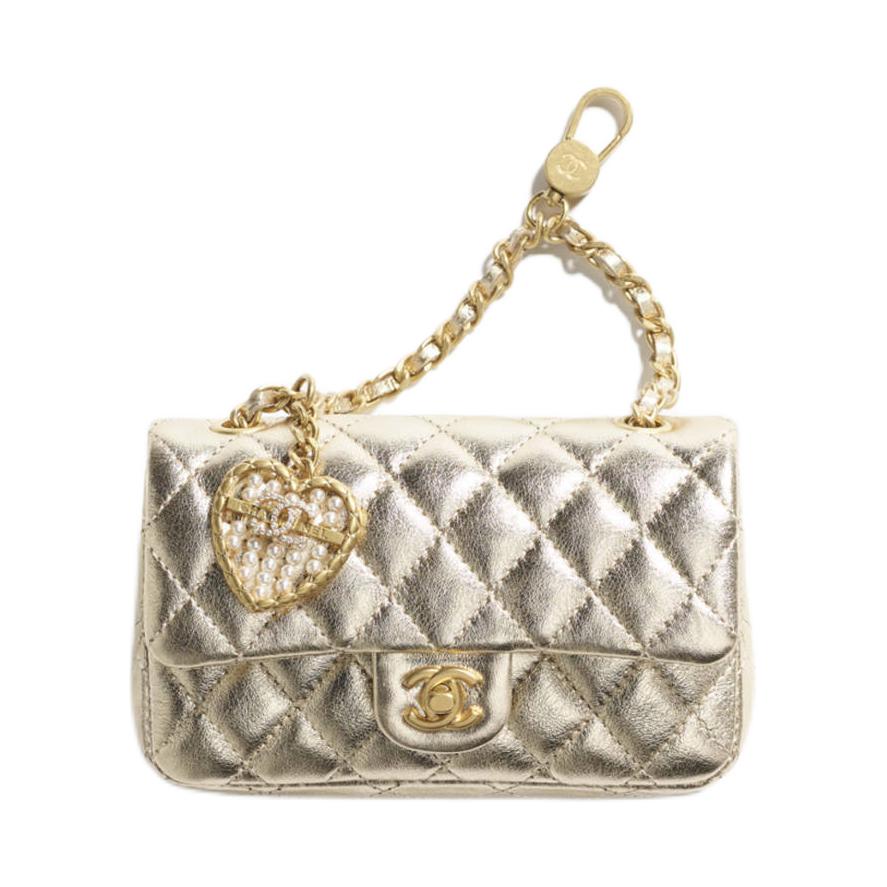 

CHANEL Миниатюрный женский кошелек для монет из коровьей кожи золотистого цвета