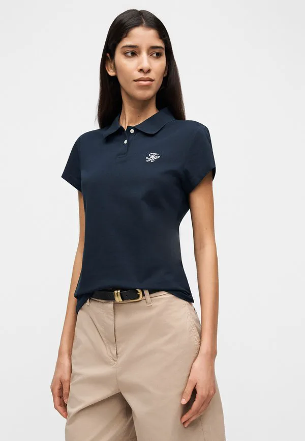 Поло-Рубашка приталенного кроя 1985 года с вышитым логотипом. Tommy Hilfiger, Dark Night Navy — фото 4