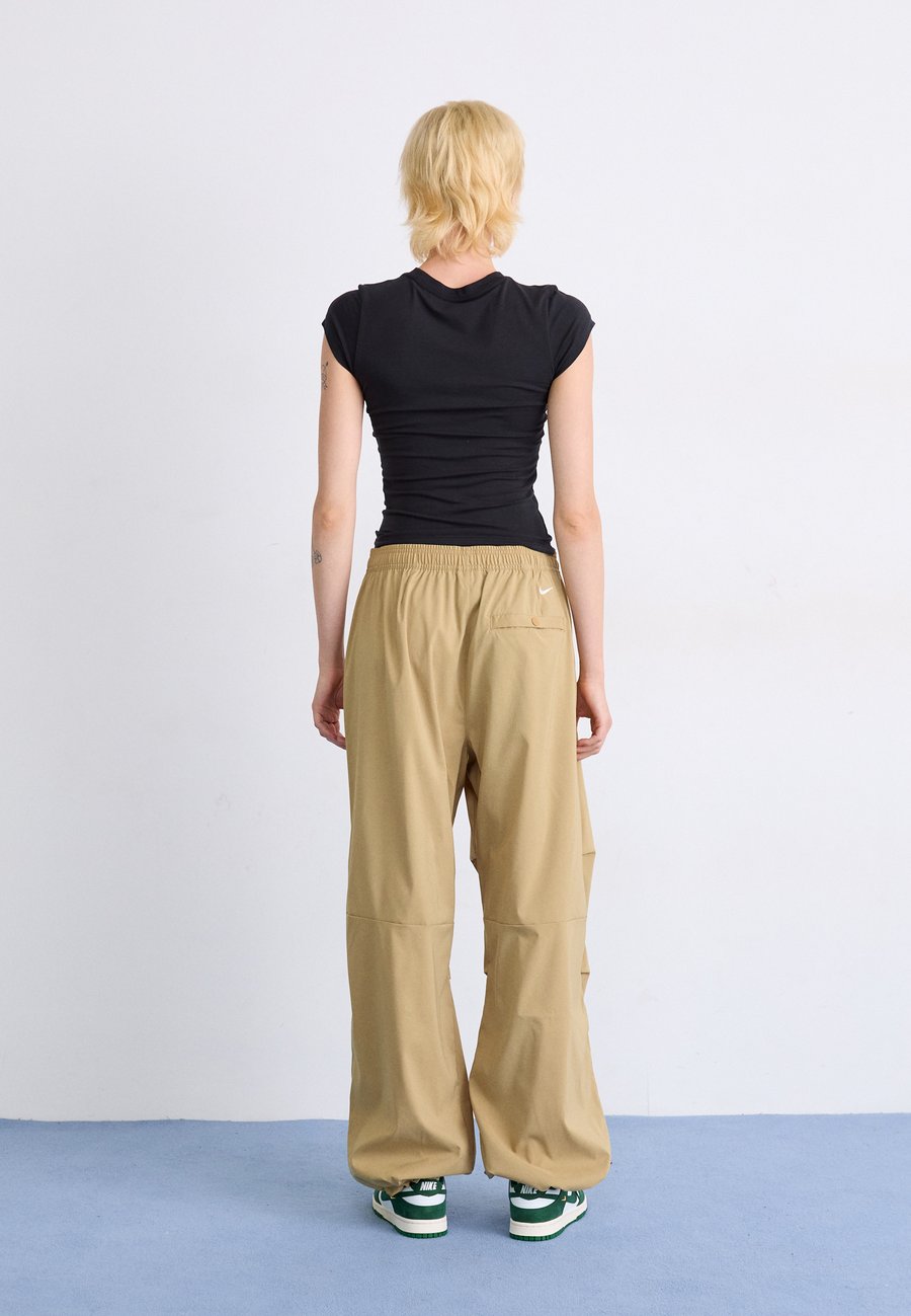 Брюки Nike ACG ACTIVITORIUM PANT, Parachute Beige/Light Khaki/Mosswood Brown/Summit White/Beige — фото 3