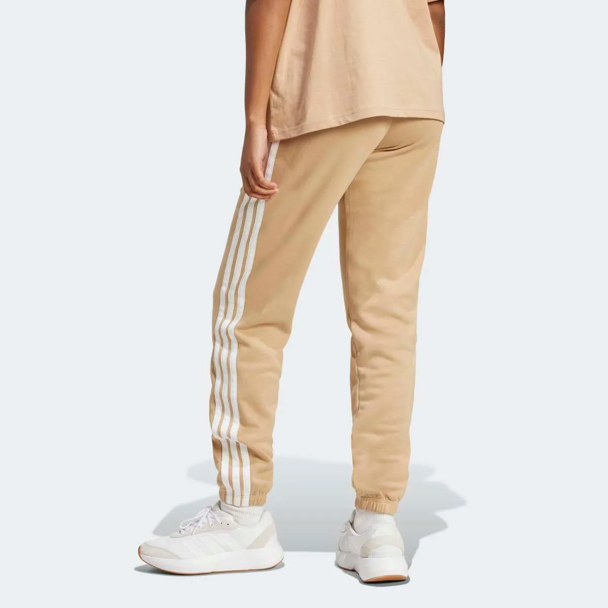 Женские брюки Essentials French Terry с манжетами и 3 полосками adidas, коричневый — фото 2