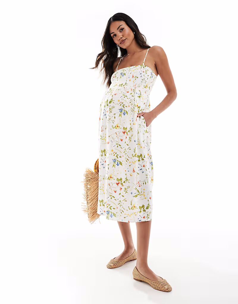 

Платье-комбинезон для беременных Vero Moda Maternity Easy с присборенной юбкой длиной до щиколотки с белыми цветочными мотивами