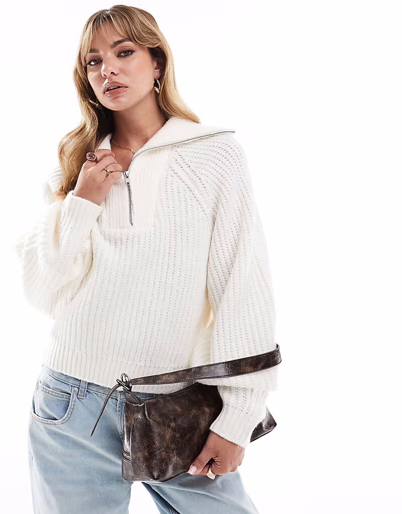 

Джемпер с высоким воротом, застежкой-молнией на половину длины и объемными рукавами кремового цвета Asos Design