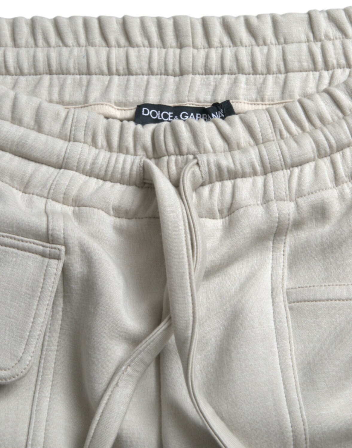 

Dolce & Gabbana Вискозный спортивный костюм-каргоМужские брюки, цвет Off White