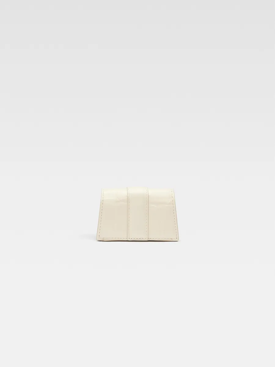 

Миниатюрный чехол для AirPods с клапаном Порт Бамбино Jacquemus, слоновая кость