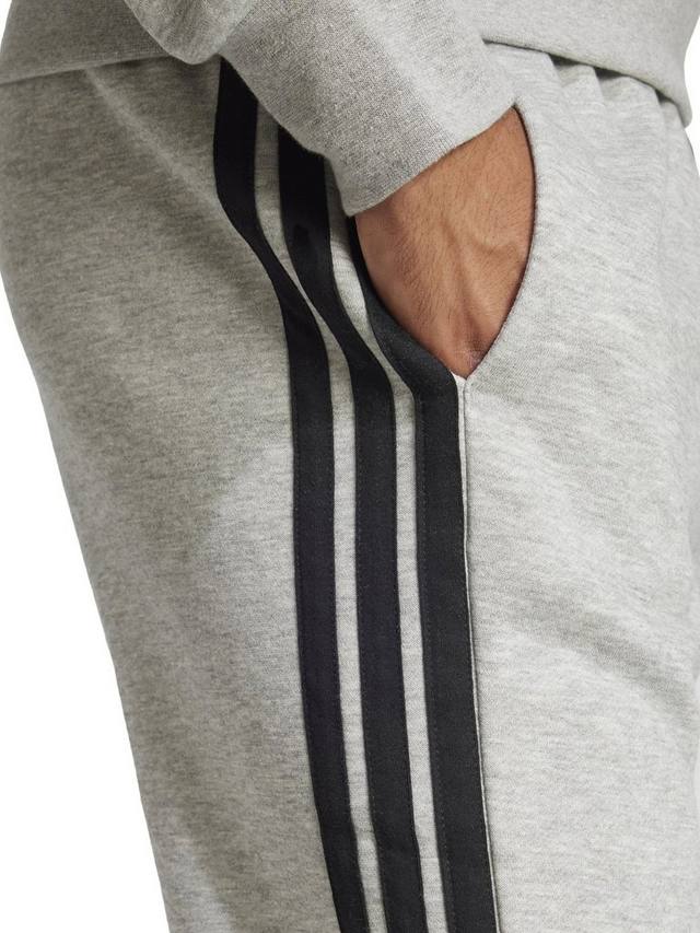 Незаменимые флисовые брюки для бега трусцой в три полосы adidas, цвет Grey Heather/Black — фото 3