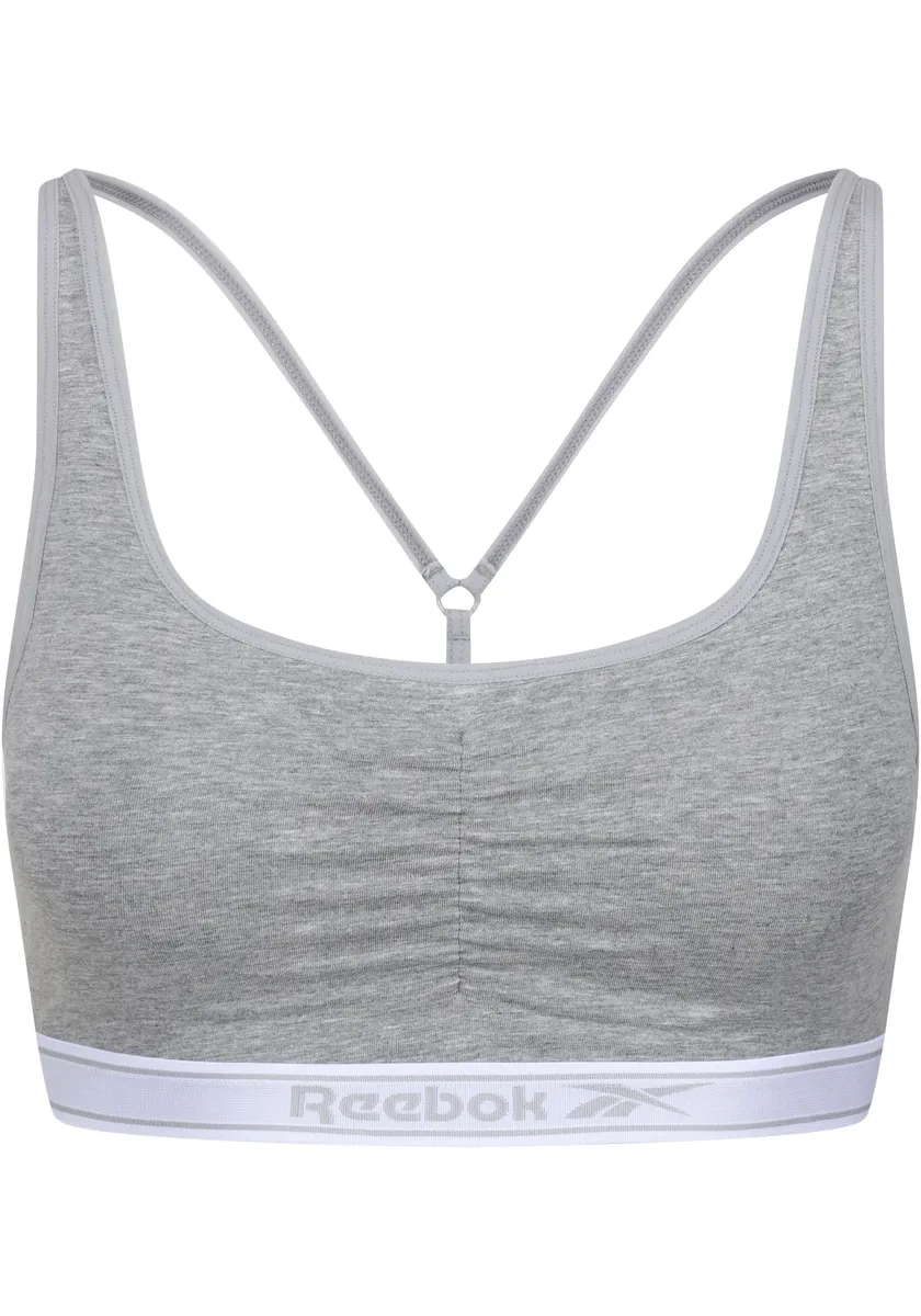 

Бюстье Reebok "Jackie", надпись-логотип на полосе под грудью, оборки спереди, серый