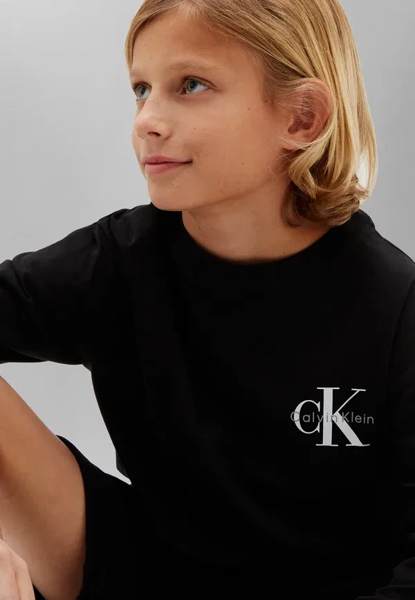 Лонгслив Calvin Klein Jeans, цвет черный — фото 4